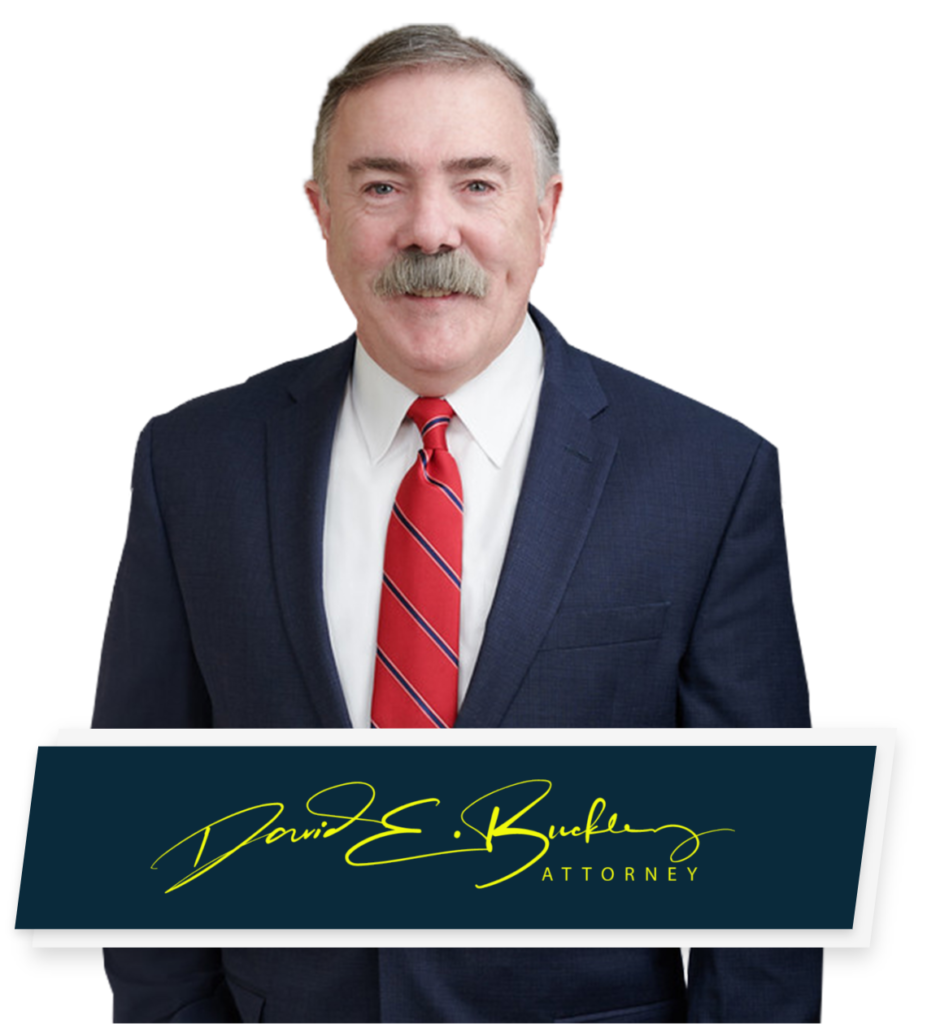 Pelham NH Car Accident Lawyer David Buckley poses for headshot with signature below