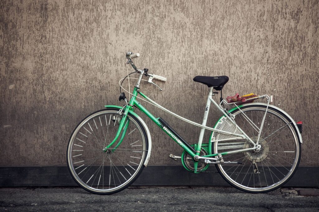 Pelham Bike Accident lawyer features photo of green bicycle leaned against brick wall